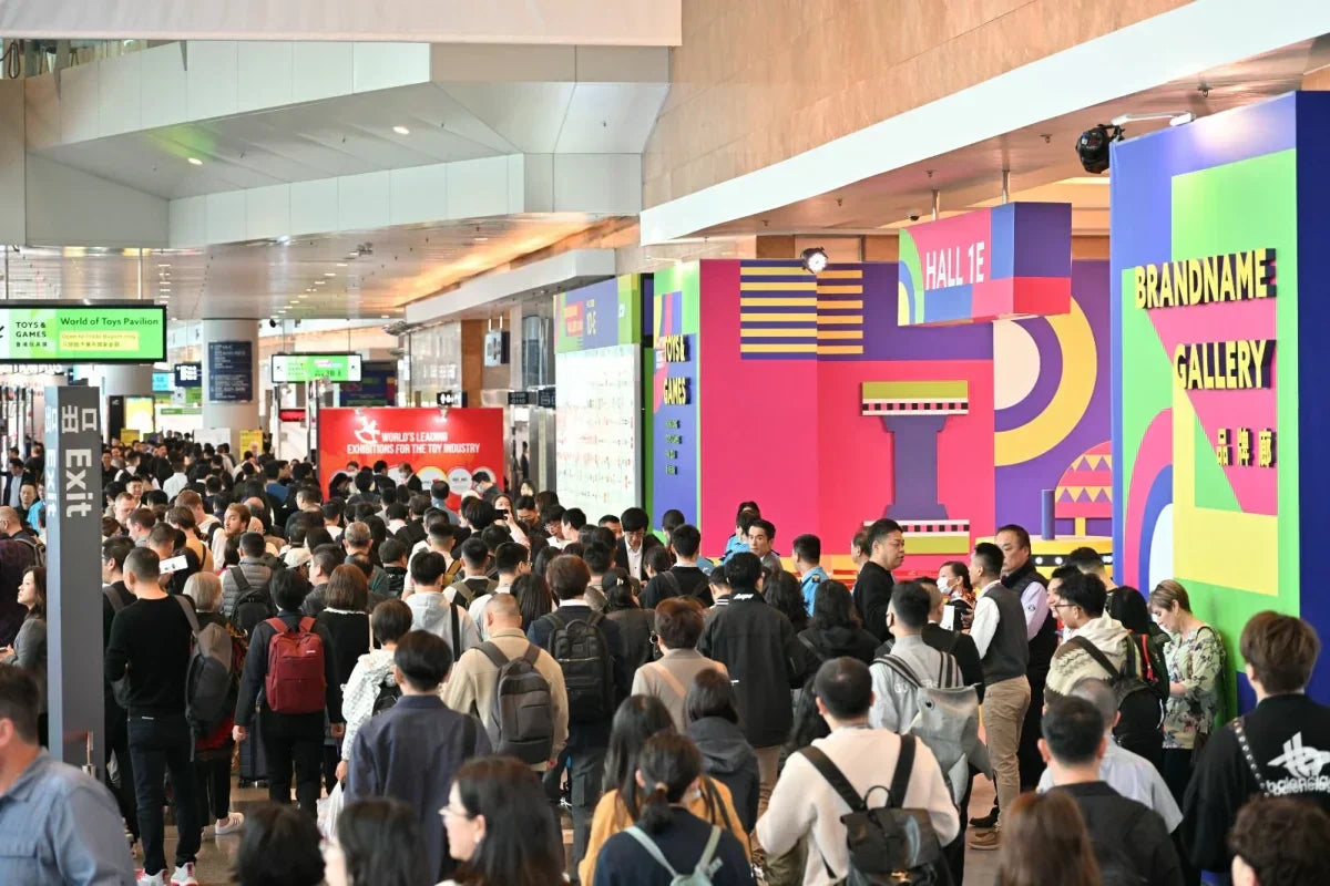 Exhibition hall with trade show booths and visitors at a professional fair