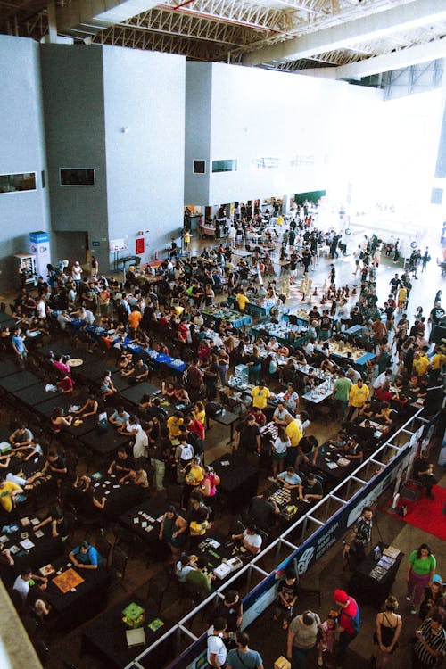Crowded convention centre hall with business professionals attending a corporate trade show event in Asia